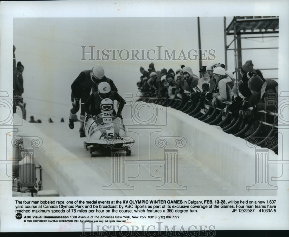 1987 Press Photo Spectators watch bobsled race at 1988 Winter Olympic Games- Historic Images