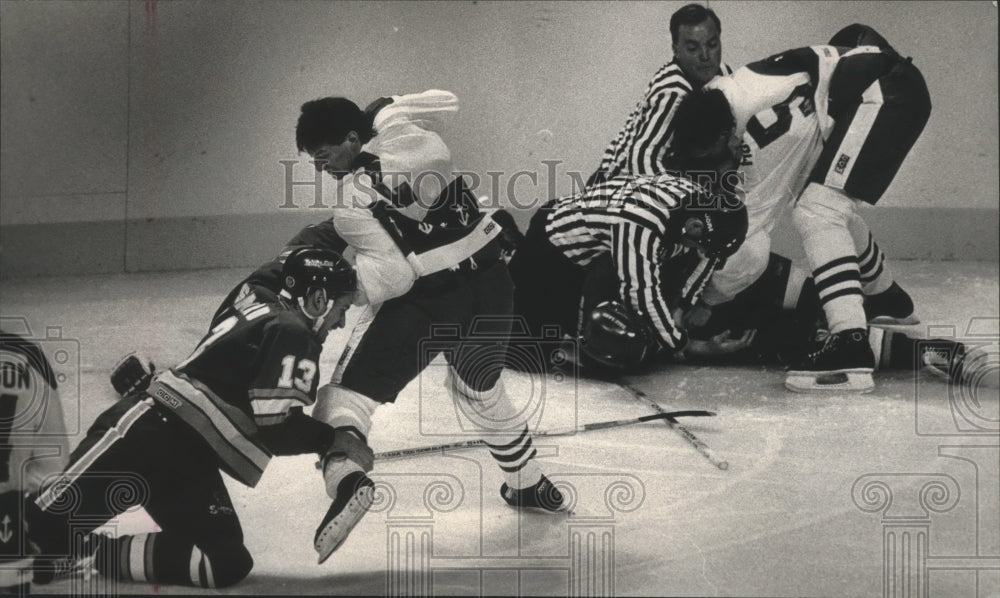 1988 Press Photo Milwaukee &amp; Salt Lake ice hockey players spar at Bradley Center- Historic Images