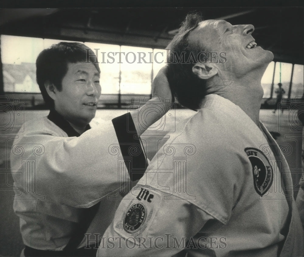 Press Photo Karate master J.K. Lee teaches Miller Brewer Co.&#39;s Dick Kalal- Historic Images