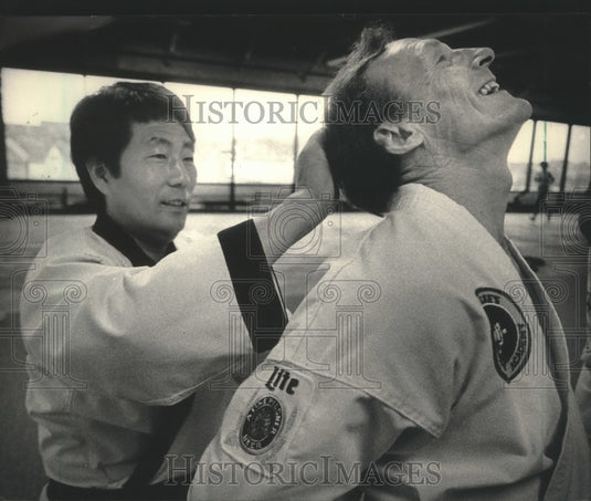 Press Photo Karate master J.K. Lee teaches Miller Brewer Co.'s Dick Kalal- Historic Images