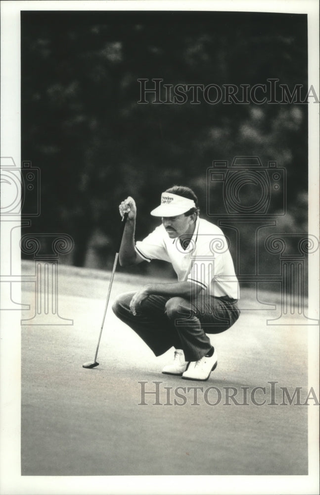 1990 Press Photo Golfer Morris Hatalsky checks out shot - mjt13626- Historic Images