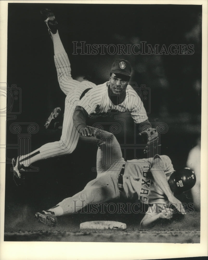 1987 Press Photo Baseball Milwaukee&#39;s Juan Castillo was upended by Bob Brower.- Historic Images