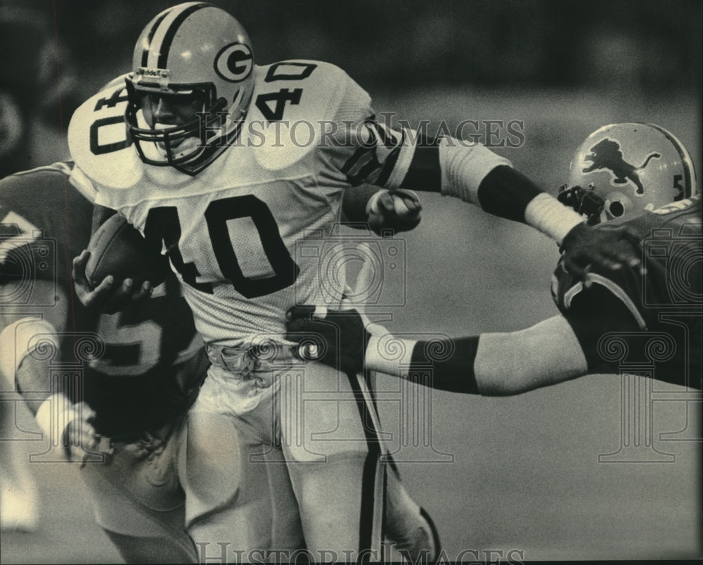 1985 Press Photo Green Bay Packers football&#39;s Eddie Lee Ivery eludes tacklers- Historic Images