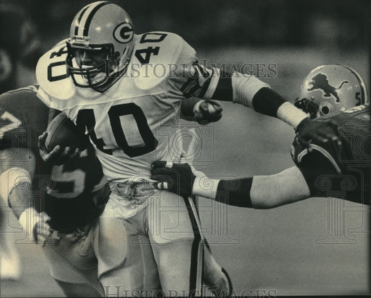 1985 Press Photo Green Bay Packers football's Eddie Lee Ivery eludes tacklers- Historic Images