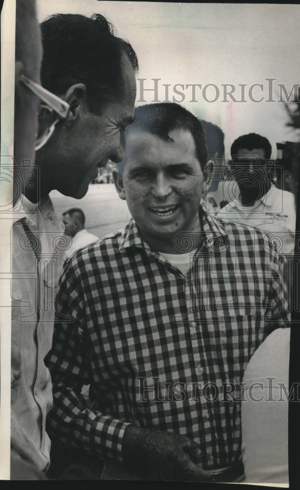 1964 Press Photo Jim Hurtubise talking with Norm Nelson in crowd. - mjt15215- Historic Images
