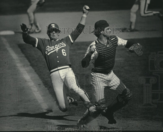 1984 Press Photo Ranger's Jones out at the plate as SundBerg throws to first- Historic Images
