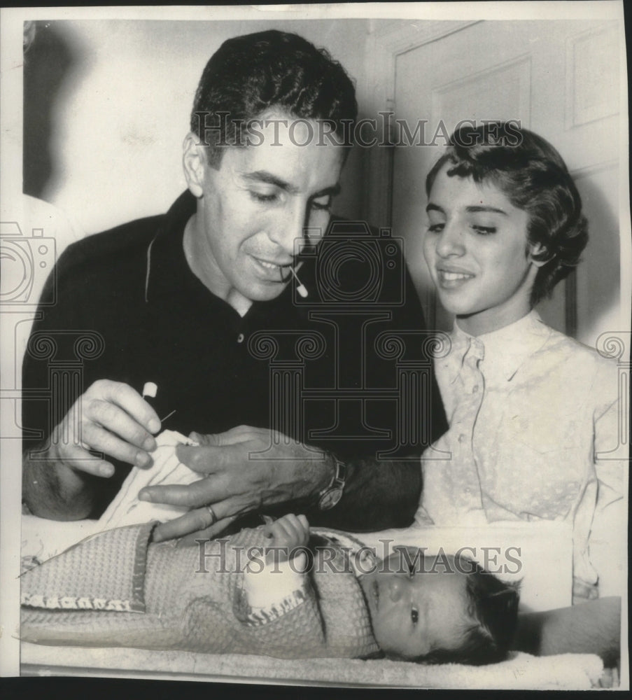 1956 Press Photo New York Yankee Phil Rizzuto changes diaper of new son, Phillip- Historic Images