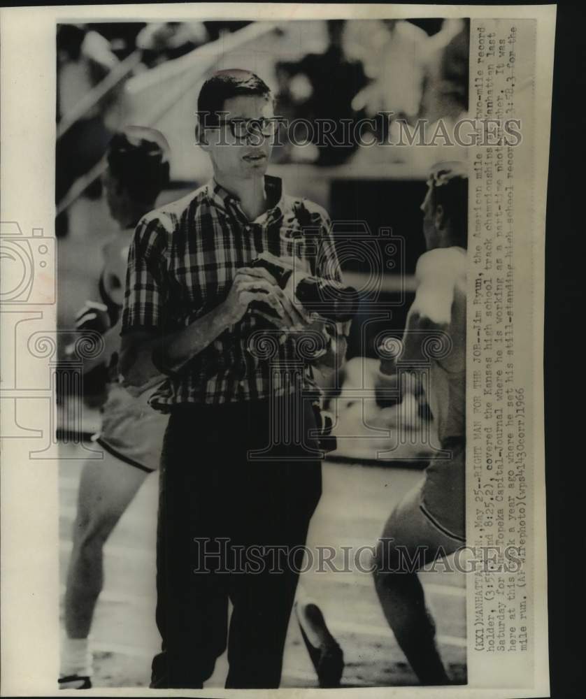 1968 Press Photo University of Kansas runner Jim Ryun snaps photos at track meet- Historic Images