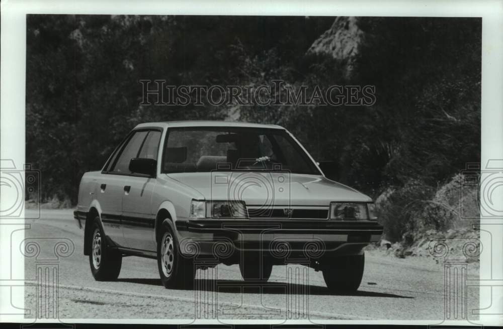 1986 Press Photo Subaru RX 4WD Turbo sedan parked on road - mjt19544- Historic Images