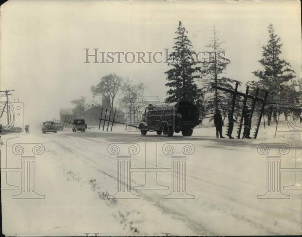 1956 Press Photo Utility crews repair downed poles from blizzard, Tess Corners- Historic Images