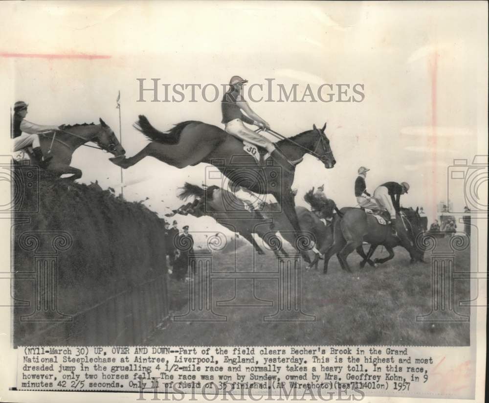 1957 Press Photo Horses Clear Becher's Brook In Steeplechase At Liverpool- Historic Images