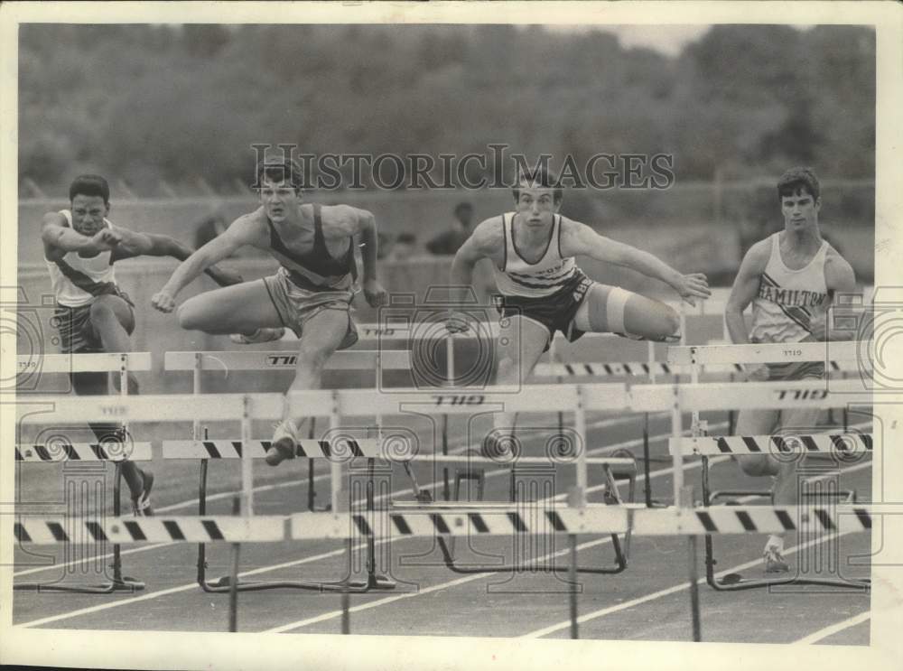1969 Press Photo High School Runners Jump Hurdles At Track Meet, Sussex Hamilton- Historic Images