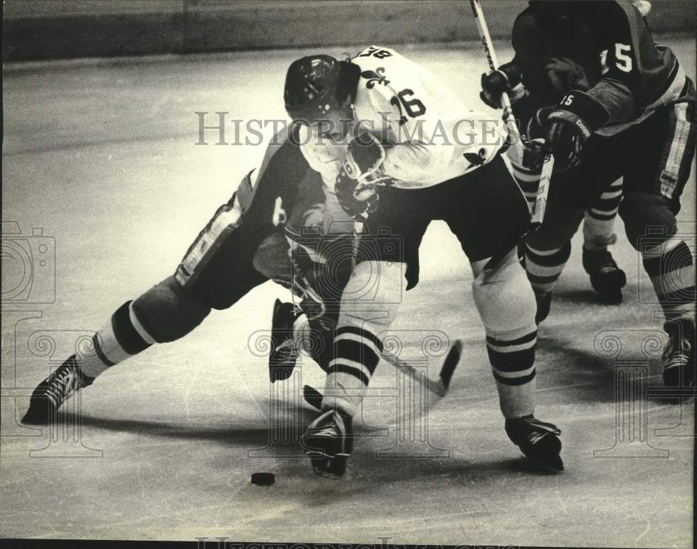 1981 Press Photo Milwaukee's Bergeron Gets Checked by Fort Wayne's Pete Crawford- Historic Images
