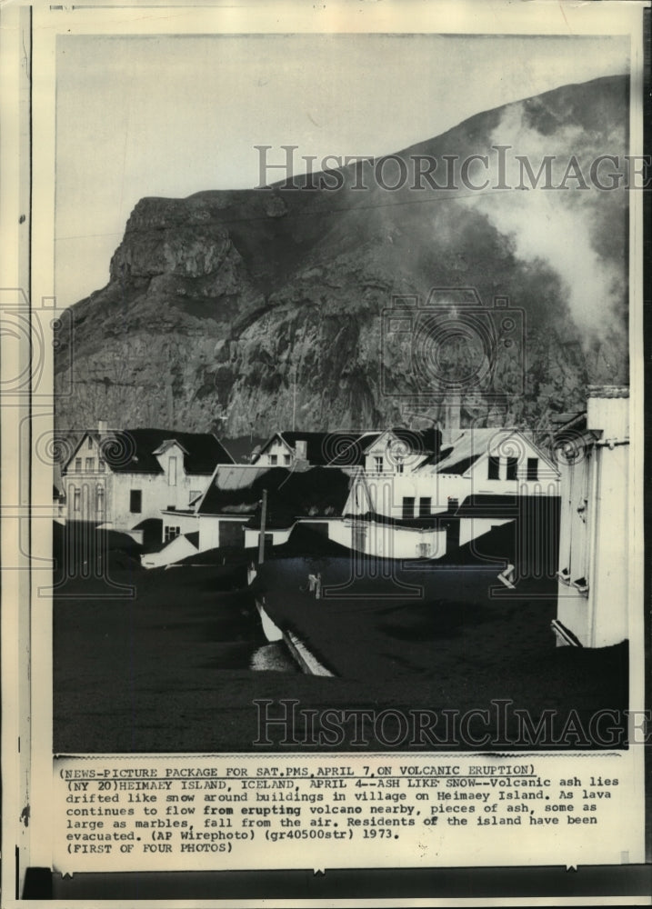 1973 Press Photo Volcanic ash drifted around buildings, Heimaey Island, Iceland- Historic Images
