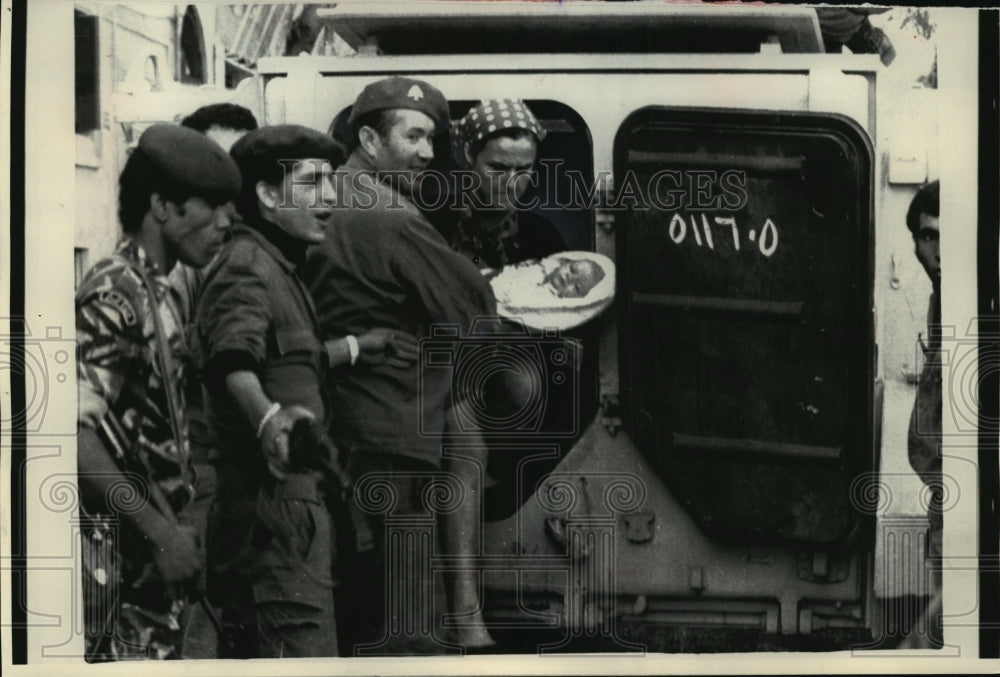 1975 Press Photo Military Help Woman And Child Evacuate By Armored Car In Beirut- Historic Images