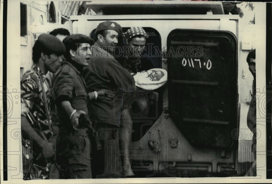 1975 Press Photo Military Help Woman And Child Evacuate By Armored Car In Beirut- Historic Images