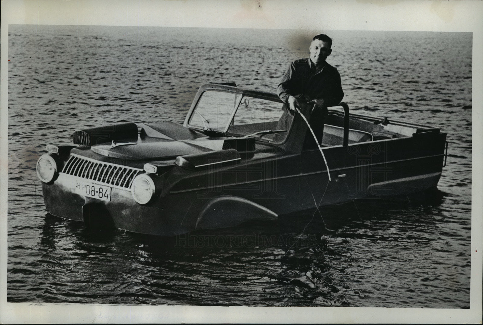 1962 Press Photo Grigori Khokhlov drops fishing line from automobile he designed
