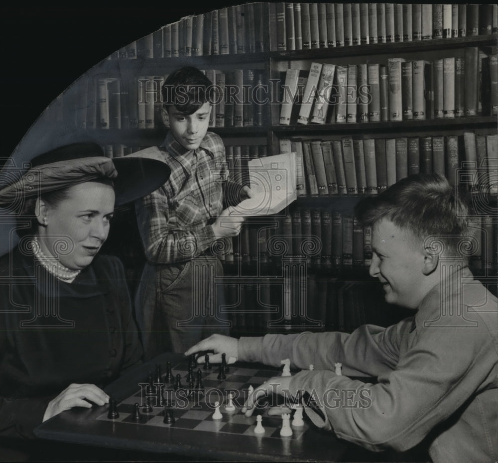 1948 Press Photo Mrs. Fred Loock plays with Boys Club member Nick Karkas