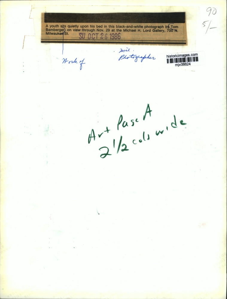 1986 Press Photo A youth sits quietly upon his bed photograph by Tom Bamberger