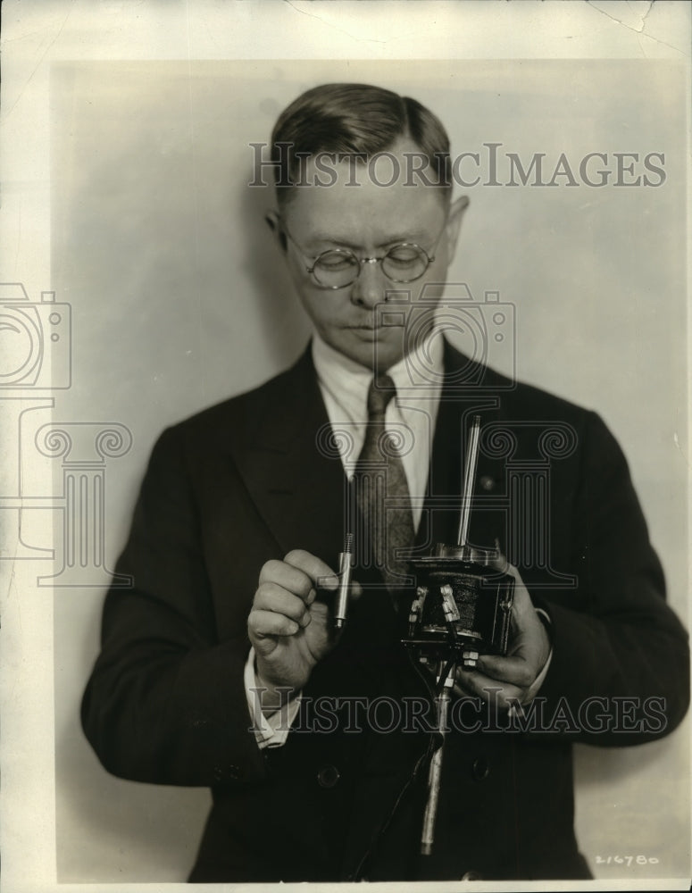 Load image into Gallery viewer, 1933 Press Photo L.G. Riley with the new electric fuel valve he developed

