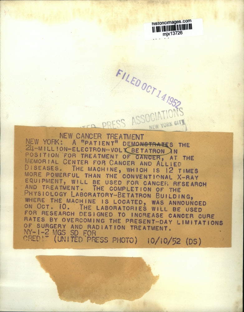 1952 Press Photo A patient demonstrates the Betatron cancer treatment machine.