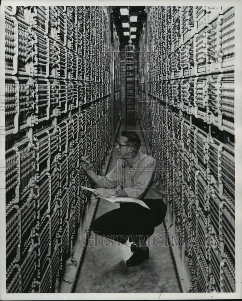 Load image into Gallery viewer, 1955 Press Photo Stephan S. Shemunatz checks switches at Wisconsin Bell Co.
