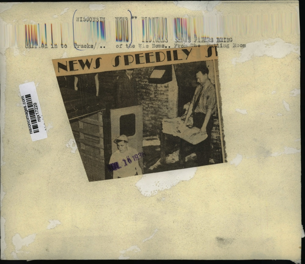 1936 Press Photo Papers Carried in to Trucks at the Wisconsin News