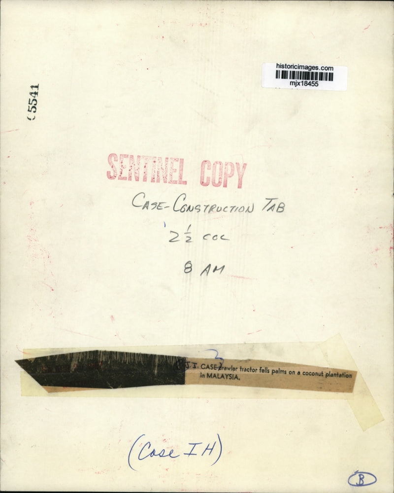 1957 Press Photo J.J. Case crawler tractor on a coconut plantation in Malaysia.