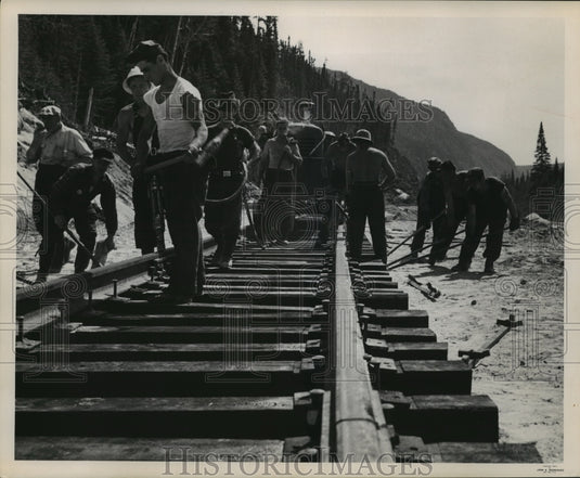 1953 Press Photo Laying down train tracks on mile 37 in Canada- Historic Images