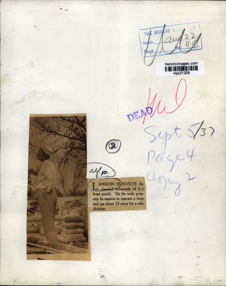 1937 Press Photo Landon surveys the classical colonnade of his front porch.