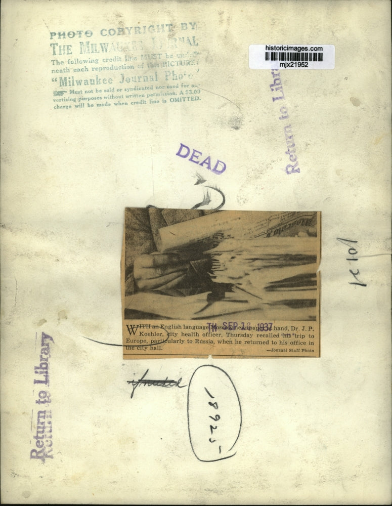 1937 Press Photo Milw.-Dr. J. P. Koehler-City health officer with Moscow paper.