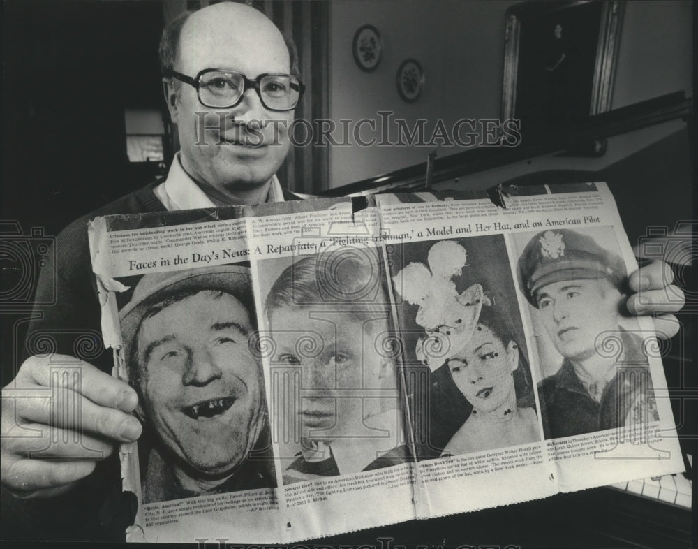 1984 Press Photo James Duggan holds 1944 journal issue from when he was 9 years- Historic Images