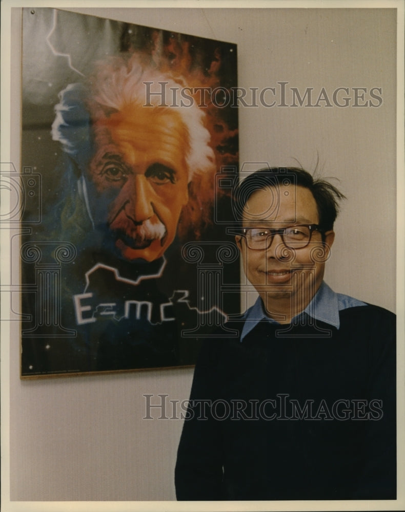 1989 Press Photo Fang Lizhi Poses with a Poster of Albert Einstein - mjx30420- Historic Images