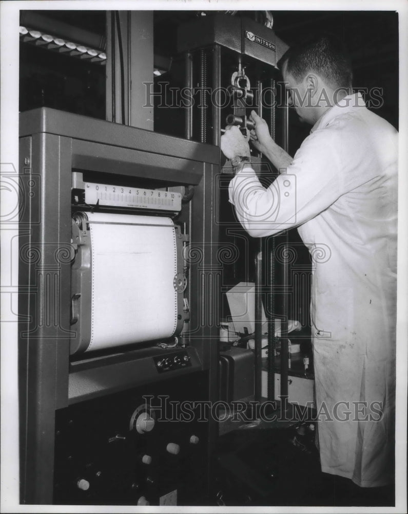 1963 Press Photo James Williston, Milprint, Tests Strength of Aluminum Foil- Historic Images