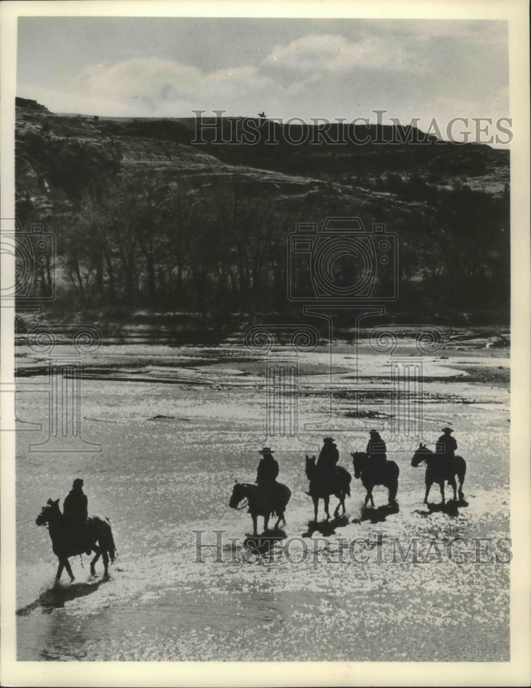 Load image into Gallery viewer, 1965 Press Photo Cowboys Cross a River Along the Old West Trail, North Dakota
