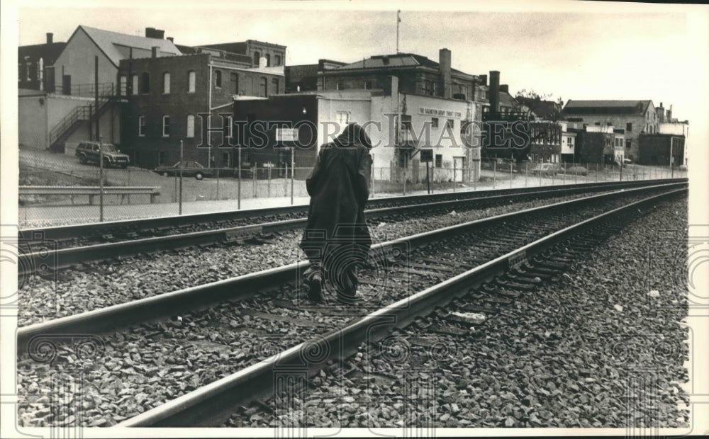 1988 Press Photo Homeless person walking on a train track - mjx40542- Historic Images