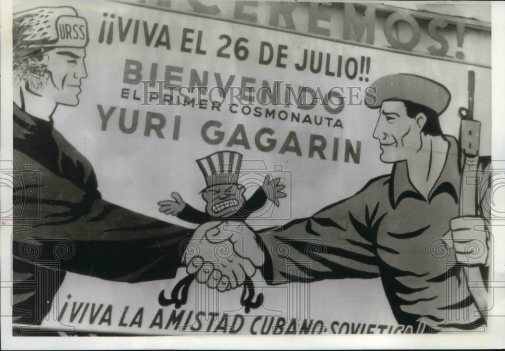 1961 Press Photo Havana, Cuba; billboard shows Cubans and Russians squeezing U.S- Historic Images