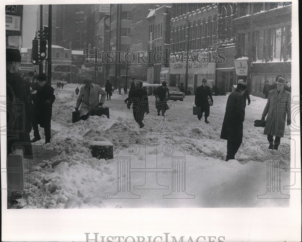 1967 Press Photo People stomping through a Milwaukee snow storm - mjx43846- Historic Images