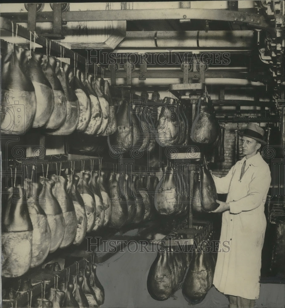 1935 Press Photo Worker With Hams and Bacon at Plankinton Packing Company- Historic Images