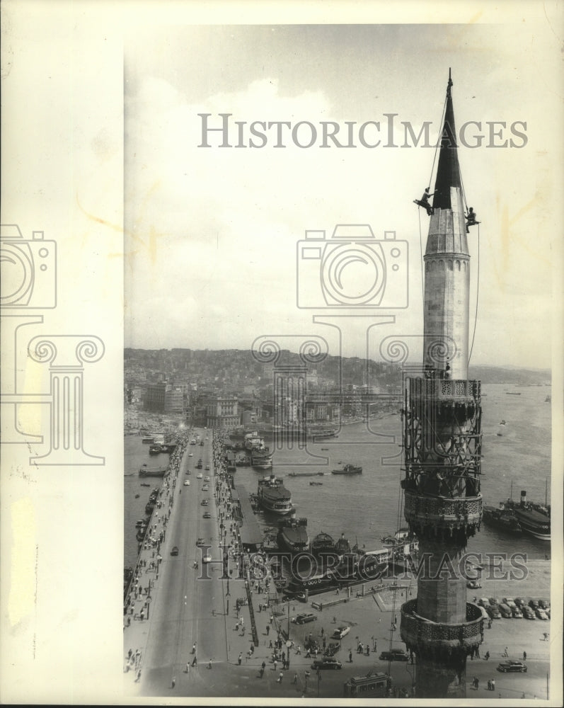 1963 Press Photo Workmen replace tin atop a mosque minaret in Galata, Turkey