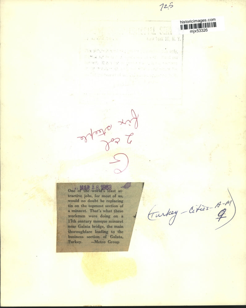 1963 Press Photo Workmen replace tin atop a mosque minaret in Galata, Turkey