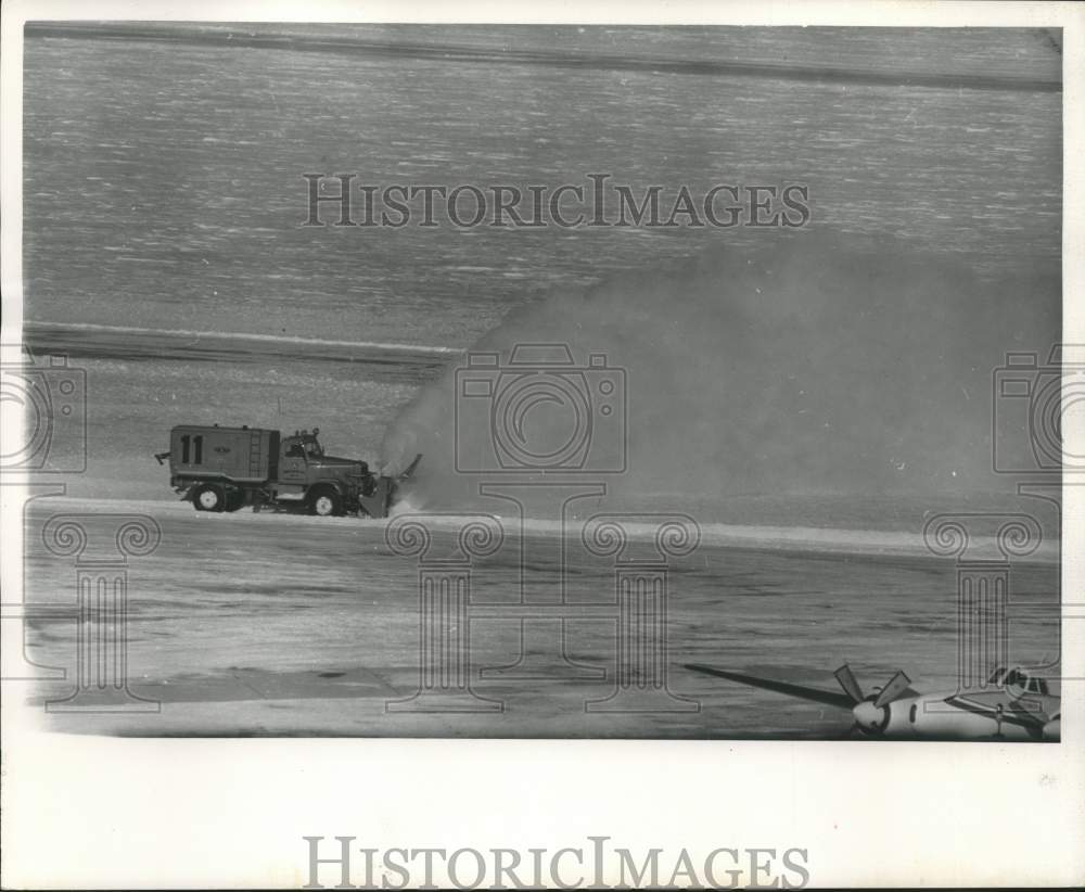1962 Press Photo Snow removal on landing strip at Mitchell Field in Milwaukee.
