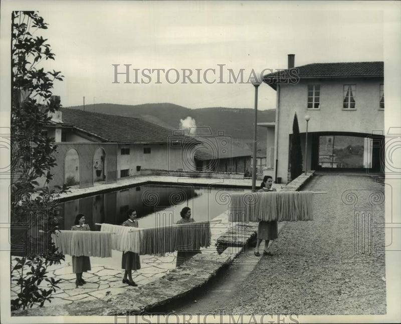 Load image into Gallery viewer, 1950 Press Photo Dried Wool Being Carried At Angora Factory At Santa Lucia Italy
