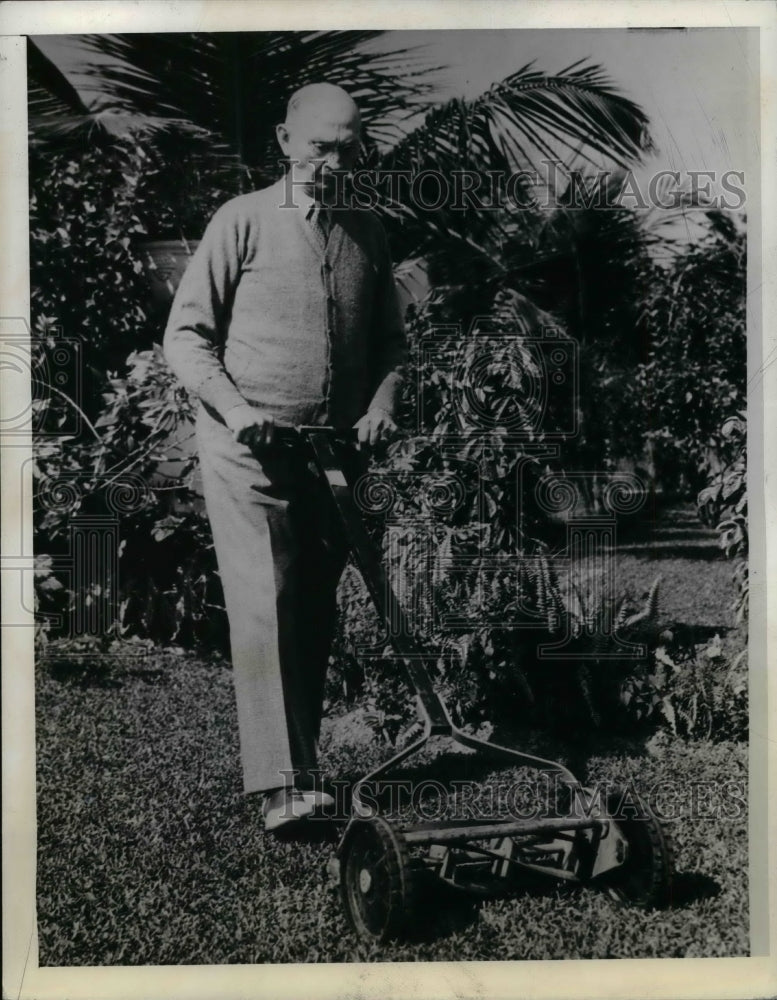 Load image into Gallery viewer, 1942 Press Photo Rep. South Trimble mowing lawn for exercise in Miami
