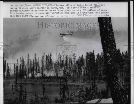 1962 Press Photo View Of Flying Aircraft Equipped With Special Spraying Water