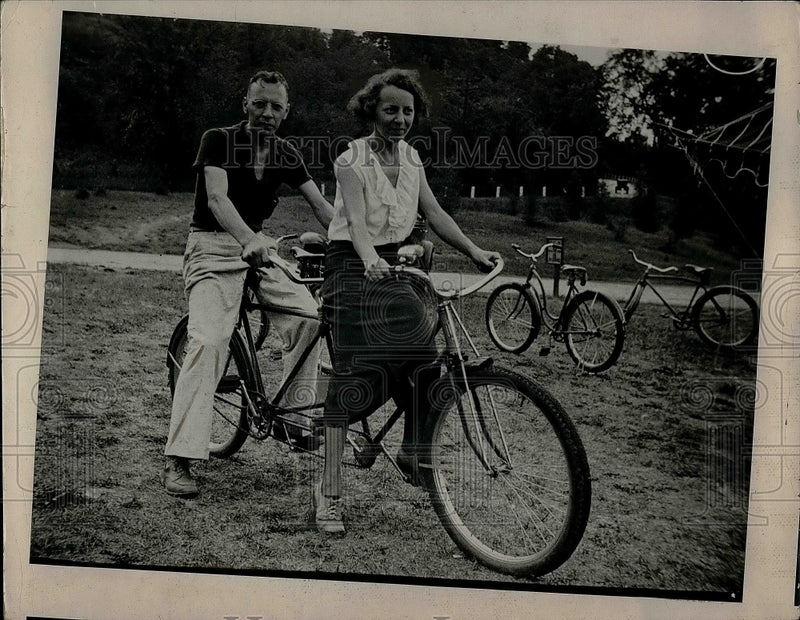 Load image into Gallery viewer, 1955 Press Photo Edwin Nelson and Wife Riding on Tandem Bike in Park - nea41913
