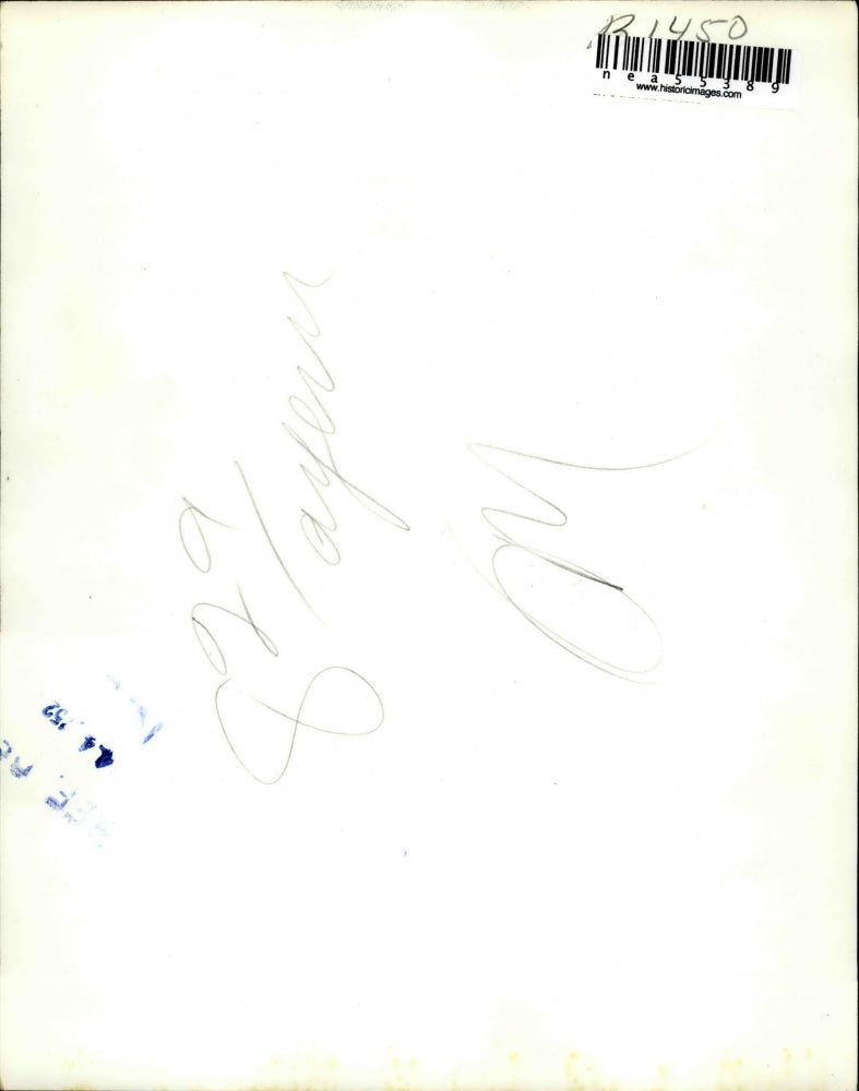 1952 Press Photo Sugar Ray Robinson Gazes At Picture Of Knocked Out Bobo Olson