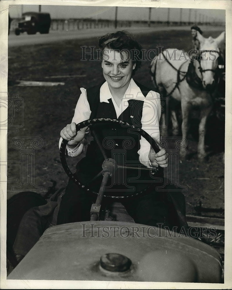 1943 Press Photo Young lady driving tractor on a farm - nea55889