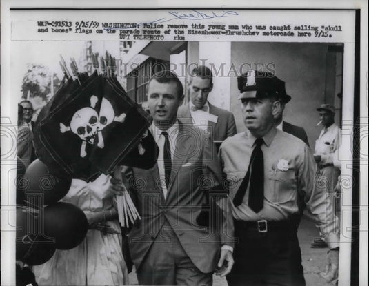 1959 Press Photo Police with man caught selling skill and bones flags