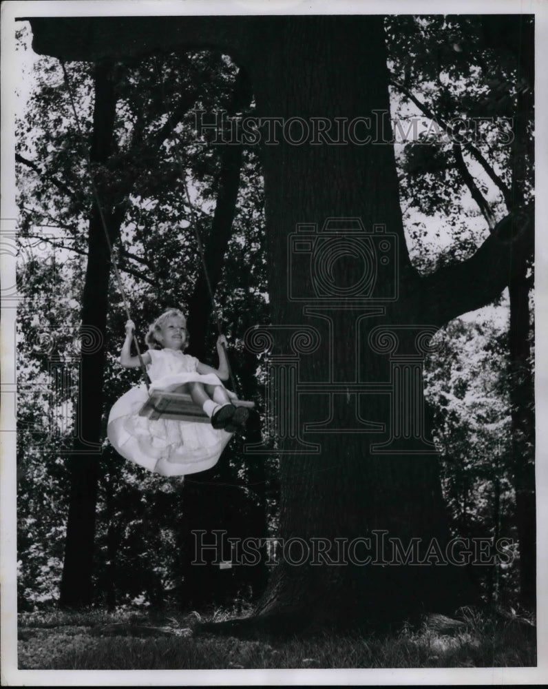 1960 Press Photo A young girl swinging